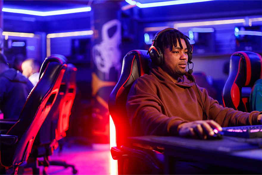 African man wearing virtual reality headset having great fun